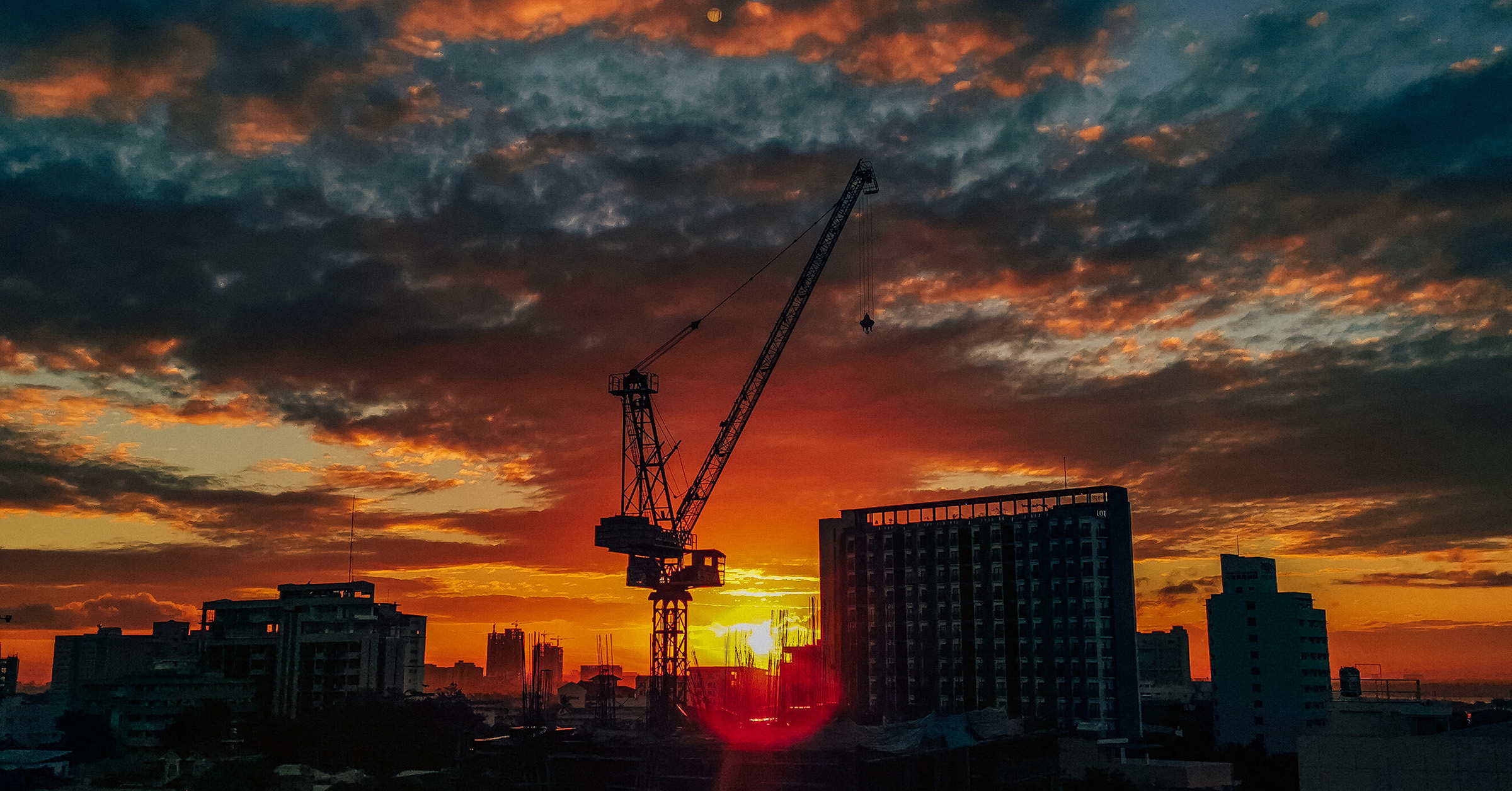 aerial-photo-of-city-buildings-with-sunset-view-24497852